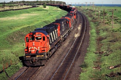 Westbound Canadian National Railway freight train led by C630M no. 2026 in Port Darlington, Ontario, on May 26, 1980. Photograph by John F. Bjorklund, © 2015, Center for Railroad Photography and Art. Bjorklund-21-07-24