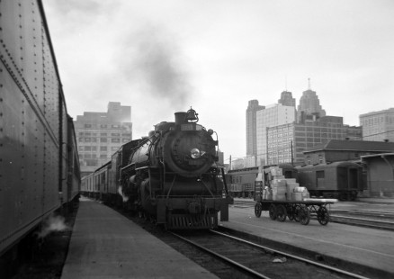 Grand Trunk Western Railroad steam locomotive no. 5633 leads passenger train in Detroit, Michigan, in 1948; Photograph by Robert Hadley. Hadley-03-093-01; © 2016, Center for Railroad Photography and Art