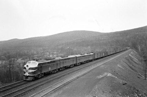 Erie Railroad A-B-B-A set of FT diesel locomotives led by no. 701 pulling a westbound freight train approaching Black Rock Cut, east of Port Jervis, New York, on April 23, 1948. Photograph by Donald W. Furler, © 2017, Center for Railroad Photography and Art, Furler-19-075-01