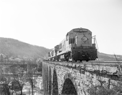 Erie Lackawanna Railroad locomotive no. 2504 crosses the Starrucca Viaduct with eastbound freight in Lanesboro, Pennsylvania on February 20, 1965. Photograph by Victor Hand. Hand-EL-30-013.JPG