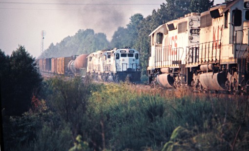 Northbound and southbound Kansas City Southern Railway freight trains near Wickes, Arkansas, on July 18, 1977. Photograph by John F. Bjorklund, © 2016, Center for Railroad Photography and Art. Bjorklund-61-10-02