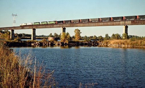 Northbound Kansas City Southern Railway coal train crossing Arkansas River in Spiro, Oklahoma, on October 21, 1988. Photograph by John F. Bjorklund, © 2016, Center for Railroad Photography and Art. Bjorklund-62-07-06