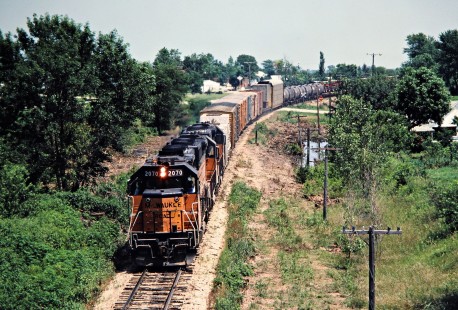 Westbound Milwaukee Road freight train in Sewal, Iowa, on July 9, 1981. Photograph by John F. Bjorklund, © 2016, Center for Railroad Photography and Art. Bjorklund-68-28-13