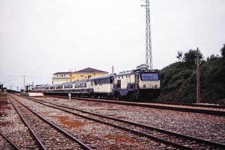 Renfe Feve diesel locomotive no. 1651 and passenger train leaves the Ribadeo station in Ribadeo, Valdes, Spain, on July 8, 2001. Photograph by Fred M. Springer, © 2014, Center for Railroad Photography and Art. Springer-Spain-BNSF-07-27