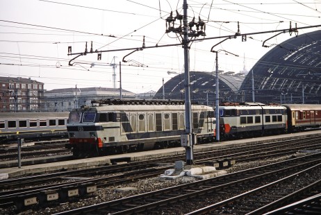 Two Italian State Railways (Ferrovie dello Stato) electric locomotives leave Milan Central Station with a passenger train in Milan, Lombardy, Italy, on March 11, 1992. Photograph by Fred M. Springer, © 2014, Center for Railroad Photography and Art. Springer-ZimZam(2)-Swiss-08-32