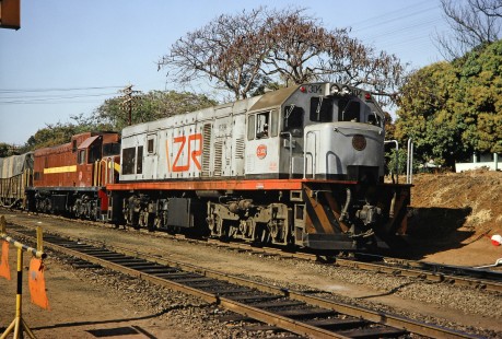 Zambia Railways diesel locomotive no. 0304 in Victoria Falls, Matabeleland North, Zimbabwe, on August 9, 1991. Photograph by Fred M. Springer, © 2014, Center for Railroad Photography and Art. Springer-ZimZam(2)-Swiss-22-31