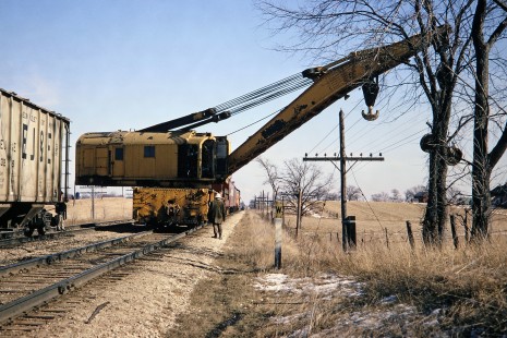 Milwaukee Road work train cleaning up a derailment on the main line three miles east of Watertown, Wisconsin, on Saturday, March 18, 1967. Photograph by Thomas F. McIlwraith, McIlwraith-01-007-11, © 2018, Center for Railroad Photography & Art, <a href="http://www.railphoto-art.org" rel="noreferrer nofollow">www.railphoto-art.org</a>