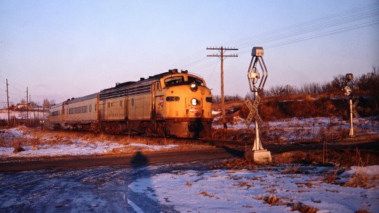 Milwaukee Road E8 diesel locomotive no. 31C leading passenger train no. 22, <i>The Sioux</i>, past wig-wag crossing signals south of Madison, Wisconsin, on Wednesday, February 12, 1969. Photograph by Thomas F. McIlwraith, McIlwraith-01-025-17, © 2018, Center for Railroad Photography & Art, <a href="http://www.railphoto-art.org" rel="noreferrer nofollow">www.railphoto-art.org</a>