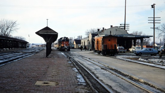 Milwaukee Road's "Wausau local" passenger train at New Lisbon, Wisconsin, on Saturday, January 28, 1967. The blue Plymouth Valiant at right belonged to the photographer. Photograph by Thomas F. McIlwraith, McIlwraith-01-006-08, © 2018, Center for Railroad Photography & Art, <a href="http://www.railphoto-art.org" rel="noreferrer nofollow">www.railphoto-art.org</a>
