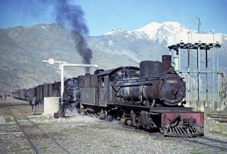 Two Viejo Expreso Patagónico (Old Patagonian Express) steam locomotives (no. 105 in the front) with a mixed train taking on water at Mamuel Choique, Río Negro, Argentina, on October 16, 1990. Photograph by Fred M. Springer. © 2014, Center for Railroad Photography and Art, Springer-SOAM1-16-02