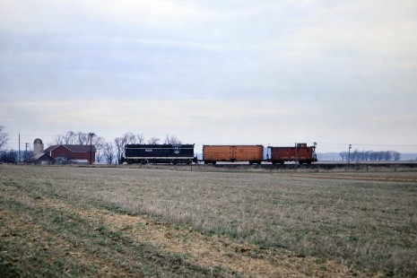 Illinois Central Railroad GP9 diesel locomotive no. 9220 leading a short freight train north of Belleville, Wisconsin, on Saturday, April 8, 1967. Photograph by Thomas F. McIlwraith, McIlwraith-01-008-11, © 2018, Center for Railroad Photography & Art, <a href="http://www.railphoto-art.org" rel="noreferrer nofollow">www.railphoto-art.org</a>