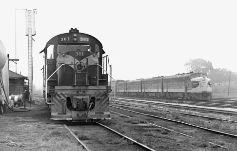 Southbound Southern Railway train passes Tennessee Central Railway units at Emory Gap, Tennessee, in June 1962. This was end point for TC's Nashville trains, although switching and interchange operations extended a few miles east of Harriman. Photograph by J. Parker Lamb, © 2016, Center for Railroad Photography and Art. Lamb-02-026-08