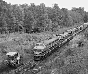 Birmingham-bound Central of Georgia Railway freight train no. 38 crawls past track crew near Goodwater, Alabama, (north of Opelika) in August 1954. Photograph by J. Parker Lamb, © 2016, Center for Railroad Photography and Art. Lamb-02-010-08
