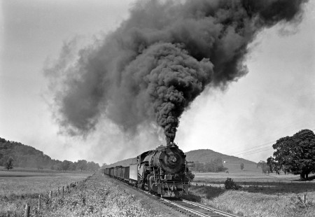 Lehigh and Hudson River 2-8-0 locomotive 93 leads a Maybrook-Allentown freight train west through Sugar Loaf, New York, in June 1950, the last year of steam operations on the railroad. Photograph by Donald W. Furler, Furler-01-086-01, © 2017, Center for Railroad Photography and Art