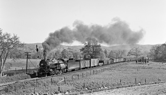 Lehigh and Hudson River 2-8-0 steam locomotive 91 pulls a twenty-nine car freight train east at Ryerson's Crossing a few miles from Warwick, New York, on May 8, 1949. Photograph by Donald W. Furler, Furler-16-014-01, © 2017, Center for Railroad Photography and Art