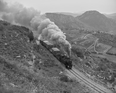 Ferrovie della Sardegna (Railways of Sardinia) steam locomotive no. 402 leads freight west of Lanusei in Sardinia, Italy, on April 10, 2002. Photograph by William Botkin. © 2002, William Botkin