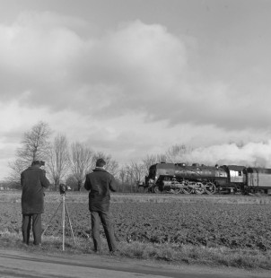 Mike Eagleson with Victor Hand photographing a French National Railways steam locomotive at Port Boulet, Nièvre, France, on January 9, 1968. Photograph by Victor Hand, Hand-SNCF-14-070