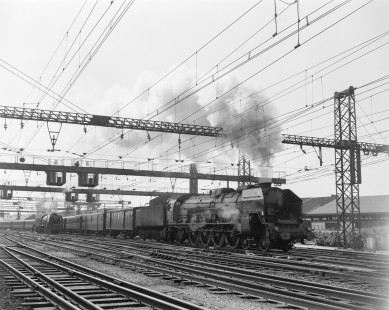 French National Railways steam locomotive no. 241-P 17 pulling passenger train no. 703 running from Paris to Quimper at La Mans, Sarthe, France, on July 8, 1963. Photograph by Victor Hand, Hand-SNCF-02-0256