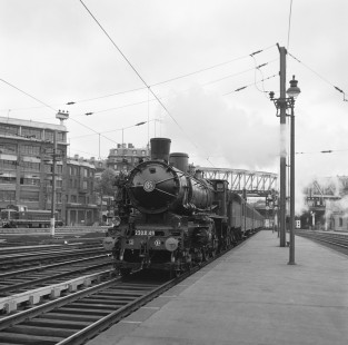 French National Railways steam locomotive no. 230-D48 leading passenger train #1406 running from Beauvais to Paris at Paris Nord, Île-de-France, France, on June 19, 1962. Photograph by Victor Hand, Hand-SNCF-X14-058