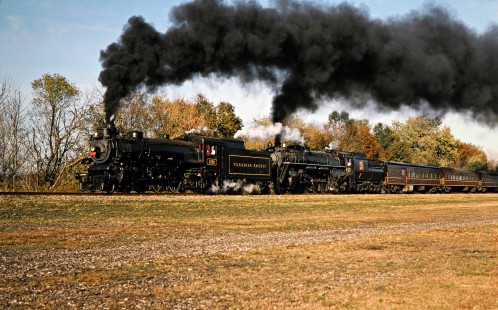 Westbound Ohio Central passenger train led by former Canadian Pacific Railway steam locomotive no. 1293 and former Grand Trunk Western no. 6325 at Trinway, Ohio, on October 19, 2003. Photograph by John F. Bjorklund, © 2016, Center for Railroad Photography and Art. Bjorklund-78-19-11