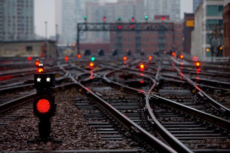 Cool and damp winter weather sets the mood at Ogilvie Station, formerly North Western Terminal, in Chicago on February 23, 2012. Numerous LED dwarf signals dot the complex interlocking. The colors convey that a train has a route out of the station, but the dual stars illuminate if a commuter train has permission to depart the terminal.