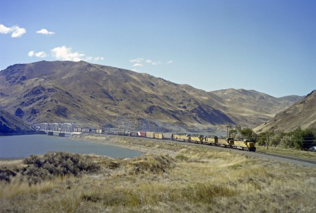 Union Pacific Railroad diesel locomotive no. 3339 leads eastbound freight train across Snake River at Rock Island, Idaho on September 9, 1979. Photograph by Victor Hand ; Hand-UP-C64-53.JPG