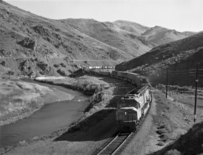 Union Pacific Railroad diesel locomotive no. 6913, hauls westbound freight on September 9, 1979 near Huntington, Oregon. Photograph by Victor Hand. Hand-UP-64-317.JPG