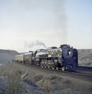 Union Pacific Railroad steam locomotive no. 8444 leads passenger train near Edison Wyoming on May 11, 1968. Photograph by Victor Hand; Hand-UP-C64-12.JPG;