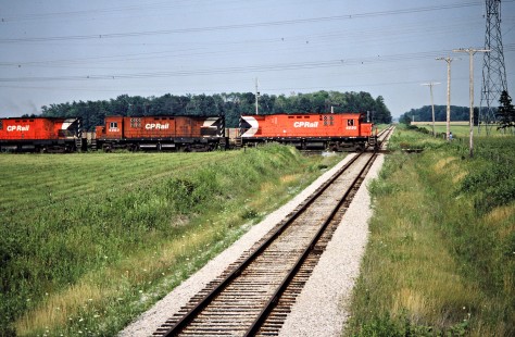 Westbound Canadian Pacific Railway freight train at Canadian National Railway crossing in Jarvis, Ontario, on July 19, 1986. Photograph by John F. Bjorklund, © 2015, Center for Railroad Photography and Art. Bjorklund-38-25-19