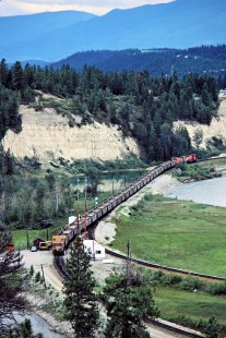 Eastbound Canadian Pacific Railway freight train next to Kootenay River in Fort Steele, British Columbia, on July 12, 1983. Photograph by John F. Bjorklund, © 2015, Center for Railroad Photography and Art. Bjorklund-38-05-15
