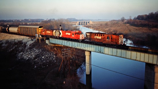Westbound Canadian Pacific Railway freight train crossing the Thames River in Woodstock, Ontario, on November 24, 1984. Photograph by John F. Bjorklund, © 2015, Center for Railroad Photography and Art. Bjorklund-38-16-20