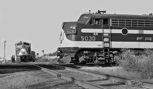Tulsa-bound Frisco train crosses Missouri–Kansas–Texas Railroad main line at Vinita, Oklahoma, in June 1959. Southbound local is headed by leased Wabash unit. Photograph by J. Parker Lamb, © 2016, Center for Railroad Photography and Art. Lamb-02-002-03