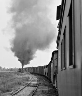 After telling Frank Carlisle of my photo interests (and my relation by marriage to a prominent local family), I was allowed to join the crew for their daily roundtrip in August 1957. By this time they had bought an ex-Frisco caboose. I grabbed a shot from the rear platform as the 2-8-0 accelerated its train. Photograph by J. Parker Lamb, © 2016, Center for Railroad Photography and Art. Lamb-02-028-09