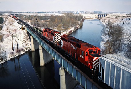 Eastbound and westbound Canadian Pacific Railway freight trains meeting near the Thames River in Woodstock, Ontario, on February 7, 1987. Photograph by John F. Bjorklund, © 2015, Center for Railroad Photography and Art. Bjorklund-39-01-06