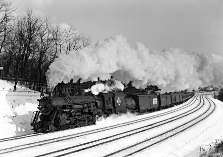 Erie Railroad 4-6-2 steam locomotive no. 2751 pulling westbound passenger train no. 27, "The Mountain Express," through the s-curve at Waldwick, New Jersey, on February 14, 1943. Photograph by Donald W. Furler, © 2017, Center for Railroad Photography and Art, Furler-09-059-02