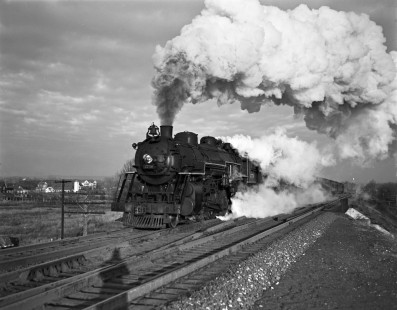 Erie Railroad 4-6-2 steam locomotive no. 2750 leading an eastbound passenger train through Passaic Junction in Elmwood Park, (formerly known as East Paterson), New Jersey in 1940. Photograph by Donald W. Furler, © 2017, Center for Railroad Photography and Art, Furler-03-034-02