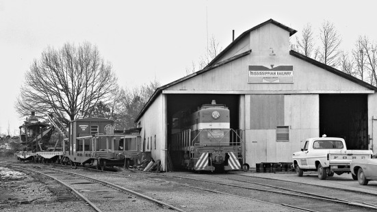 Lamb's final shot of Mississippian Railway enginehouse shows a modern caboose as well as ditching equipment in December 1964. Photograph by J. Parker Lamb, © 2016, Center for Railroad Photography and Art. Lamb-02-030-08