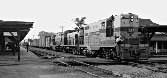 Birmingham-bound Central of Georgia Railway freight train no. 29 crosses tracks of West Point Route at station in Opelika, Alabama, in July 1952. Photograph by J. Parker Lamb, © 2016, Center for Railroad Photography and Art. Lamb-02-008-04