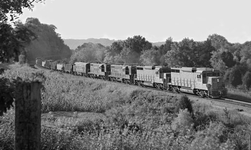 Chattanooga-bound coal train approaches Tullahoma, Tennessee, behind old and new Louisville and Nashville Railroad motive power in August 1963. Photograph by J. Parker Lamb, © 2016, Center for Railroad Photography and Art. Lamb-01-145-07