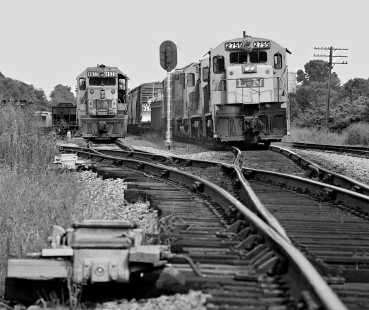 Chattanooga-bound Louisville and Nashville Railroad freight train heads into yard at Cowan, Tennessee, in August 1965. Pusher locomotive at left will assist in climb to Sherwood. Photograph by J. Parker Lamb, © 2016, Center for Railroad Photography and Art. Lamb-01-147-07
