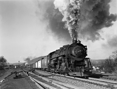 Erie Railroad 2-8-4 steam locomotive no. 3360 leading the fourth section of eastbound freight no. 98 out of Port Jervis, New York, on October 27, 1940. Exhaust from pusher locomotive no. 3209 is visible in the distance. Photograph by Donald W. Furler, © 2017, Center for Railroad Photography and Art, Furler-03-052-03
