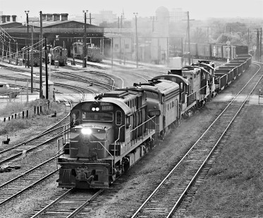 Eastbound Southern Pacific Railroad freight train passes locomotive shop as it enters SP's East Yard in San Antonio, Texas, in May 1964. Photograph by J. Parker Lamb, © 2016, Center for Railroad Photography and Art. Lamb-02-051-06