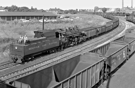 Norfolk and Western Railway steam locomotive no. 212 shoving loads to Pennsylvania Railroad in yard at Columbus, Ohio, in August 1956. Photograph by J. Parker Lamb, © 2015, Center for Railroad Photography and Art. Lamb-01-011-01