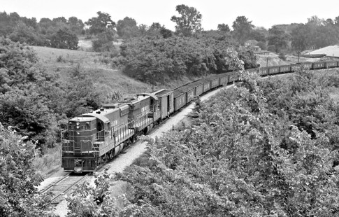 Two Chicago & Illinois Midland Railway diesel locomotive SD9's lead Havana-bound coal train upgrade at Petersburg, Illinois, in June 1959. Photograph by J. Parker Lamb, © 2015, Center for Railroad Photography and Art. Lamb-01-054-11