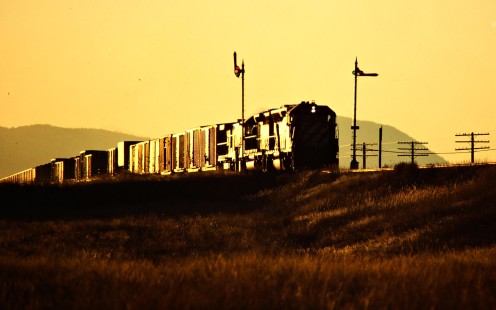 Westbound Burlington Northern Railroad freight train in East Helena, Montana, on October 4, 1984. Photograph by John F. Bjorklund, © 2015, Center for Railroad Photography and Art. Bjorklund-13-05-12