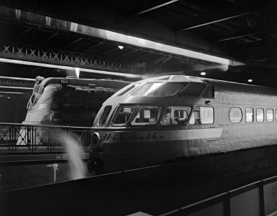 Two streamlined Hiawatha passenger trains of the Milwaukee Road at Chicago Union Station, circa 1950, offer striking commentary on industrial design. Leading the train in the background is F7-class 4-6-4 steam locomotive no. 102, designed by Otto Kuhler. One of the famed Skytop Lounge observation cars, by Brooks Stevens, dominates the foreground. Photograph by Wallace W. Abbey, © 2015, Center for Railroad Photography and Art. Abbey-03-080-01