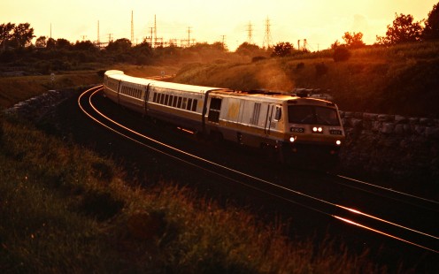 Eastbound VIA Rail passenger train on the Canadian National Railway in Kingston, Ontario, on July 6, 1985. Photograph by John F. Bjorklund, © 2015, Center for Railroad Photography and Art. Bjorklund-21-24-07