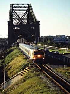 Westbound VIA Rail passenger train crossing the St. Lawrence River on the Canadian National Railway in Charny, Quebec, on August 19, 1986. Photograph by John F. Bjorklund, © 2015, Center for Railroad Photography and Art. Bjorklund-22-09-07