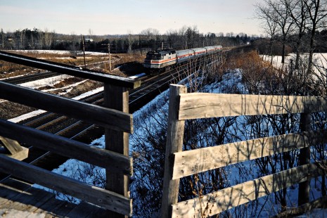 Westbound Amtrak passenger train on the Canadian National Railway in Hyde Park, Ontario, on January 17, 1987. Photograph by John F. Bjorklund, © 2015, Center for Railroad Photography and Art. Bjorklund-22-16-22