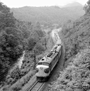 Brake shoe clouds surround eastbound Southern Railway <i>Carolina Special</i> passenger train as it nears Old Fort, North Carolina, in August 1961. Photograph by J. Parker Lamb, © 2016, Center for Railroad Photography and Art. Lamb-01-082-02